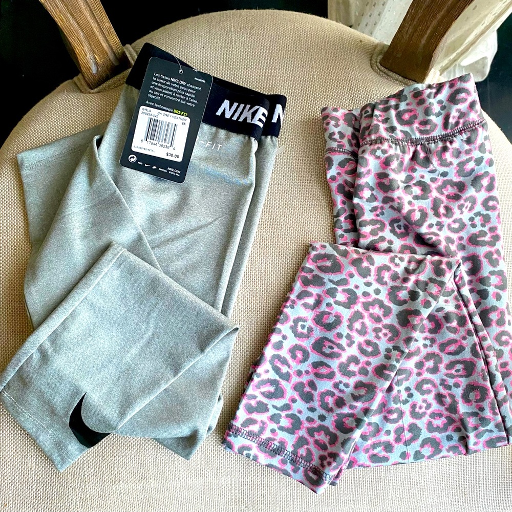 2 pairs of girls’ athletic 6x pants. Nike grey NWT &  pink animal print Reebok.